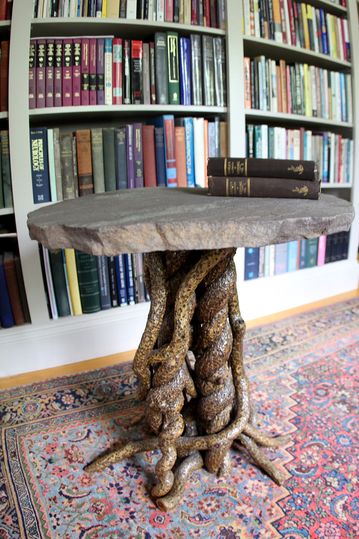 Round table - bittersweet vine base with stone table top by Nancy Reilly of Entangled Furnishings